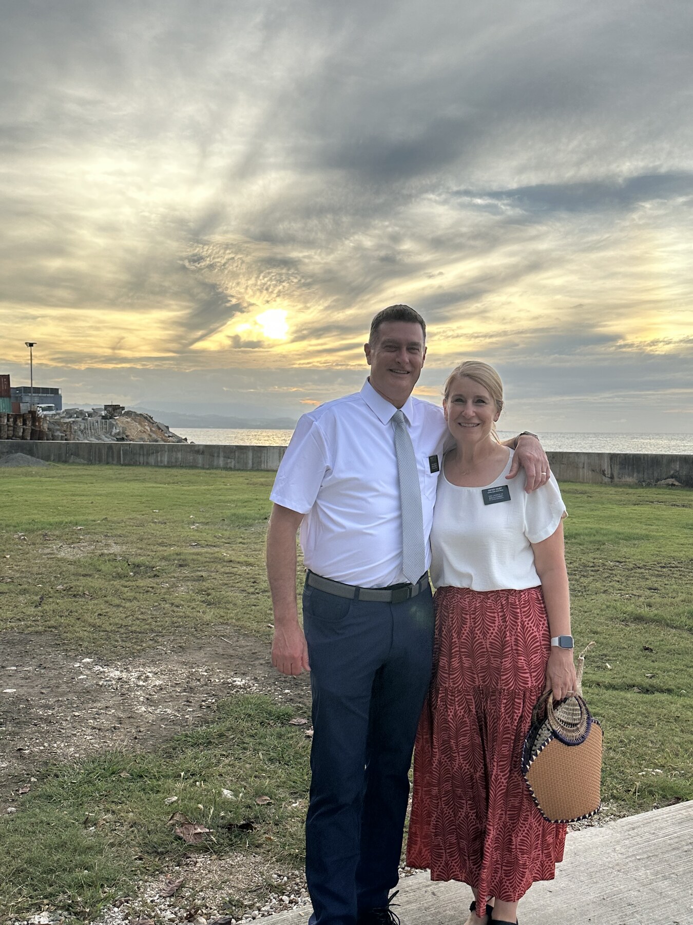President and Sister Court together near the water at sunset